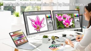 A graphic designer working at a desk with two computer monitors displaying a pink flower illustration and a photograph of pink flowers. The desk also has a laptop with a color palette on the screen, a color wheel, a small plant, and various office supplies. The text "Best Graphic Design Services Online | Hire Top Remote Freelancers" is displayed at the top of the image.